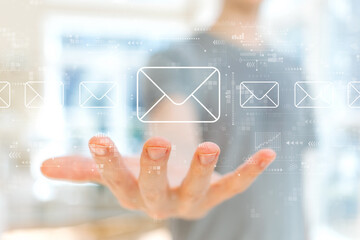Email concept with young man holding his hand