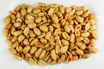 peanut. peanuts on a white background. roasted fragrant delicious grains of peanuts with seasoning