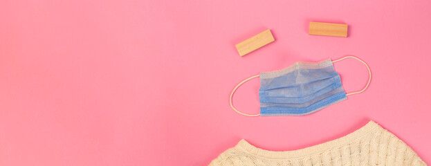 Tired of COVID-19 people creative flat lay concept, banner with a medical mask on a pink background