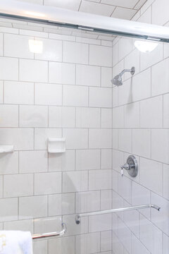 Renovated White Subway Tile Bathroom Shower With Glass Door