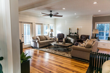 A new addition of an updated living room and den with pine hardwood floors