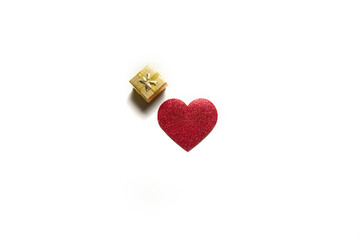 single red heart and small gift box on a white background. isolate. valentine's day