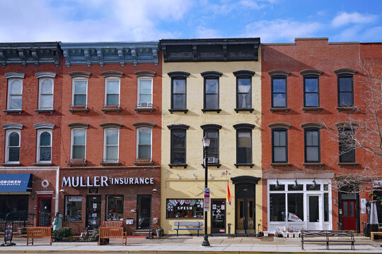 Hoboken, NJ, USA - December 28, 2020:  Hoboken's Main Street Has Local Shops In Well Preserved 19th Century Buildings.