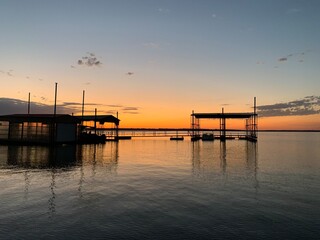 sunset through boathouses