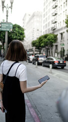 asian woman hipster travel and using the mobile phone in the city street.