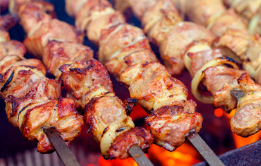 Shish kebab of meat skewered on a grill
