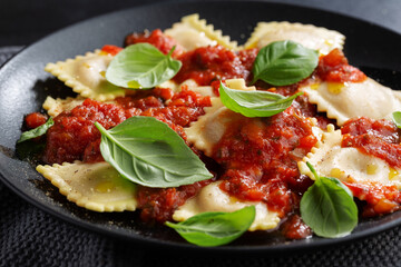 Ravioli with tomato sauce on plate