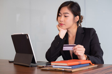 Busiesswoman holding creditcard and using laptop computer for online shopping, Online Payment, e-commerce, internet banking.