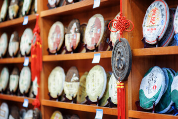 Traditional Chinese tea on wooden shelves at tea shop, Lijiang