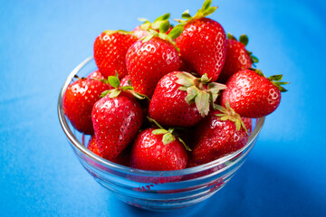 
Fresh strawberries on light blue background