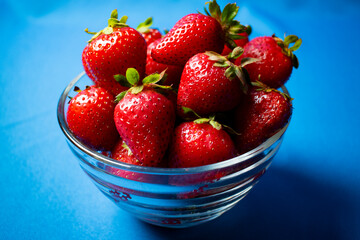 
Fresh strawberries on light blue background