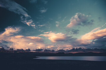 Mountain landscape with dramatic clouds in Xinjiang, China