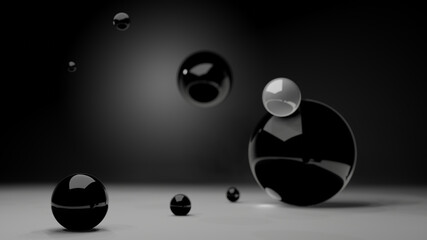 A shinning black plastic ball on white floor with blur back and white ball in background (3D Rendering)