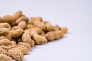 Peanuts with shells on white background