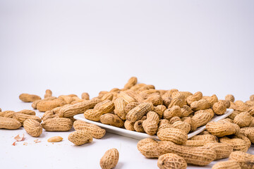 Peanuts with shells on white background