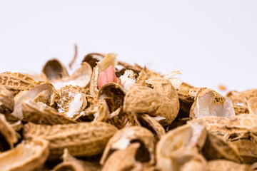 Peanuts with shells on white background