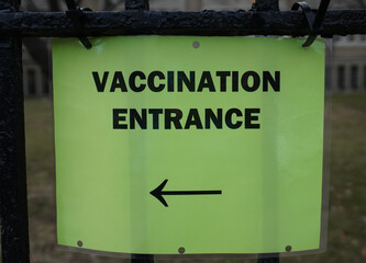 Covid - 19 vaccination site entrance sign 