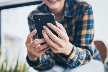 using cell phone hand holding mobile texting message contact us.chatting,search internet...