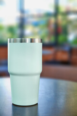 Mockup coffee mug on table in restaurant and cafe