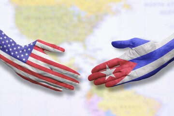 Naklejka premium Cuba and USA - Flag handshake symbolizing partnership and cooperation with the United States of America