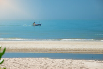 Sea morning Tropical horizontal composition,   Beach has a small fishing boat, Hua Hin,Cha Am,Thailand.