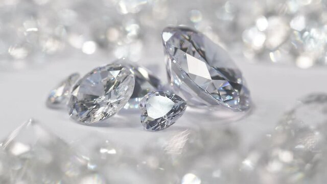 close up white diamonds of various sizes are placed in a center circle on a white background surrounded by white diamonds..