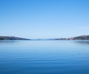 Bay, sky and mountains