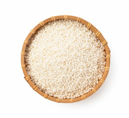 Glutinous rice in a bamboo colander on a white background