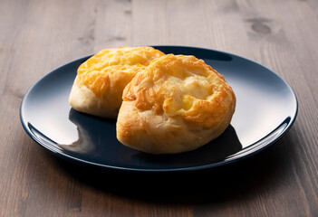 Cheese French bread placed in the background on a wooden table