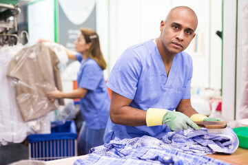 Portrait of male laundry worker during daily work