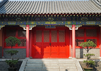   Xi Qiao Mountain Guoyi Movie and TV City, Foshan, China. Chinese wooden ornamented doors and porch in the traditional style, the sample of  Lingnan architectural style.   