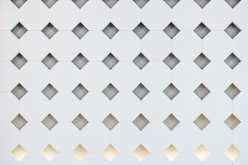 Building white diamond shape square wall pattern design with lighting indoor background