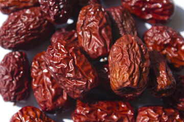 close up Red dates on white background.