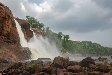 waterfall falling from mountain too at morning from low angle