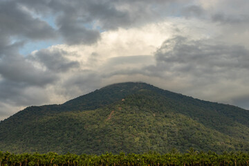 Fototapeta premium Mountains Velliangiri view with blue sky and green forest