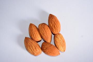 Top View of Closeup Organic Almond Nuts in Group On isolated White Background