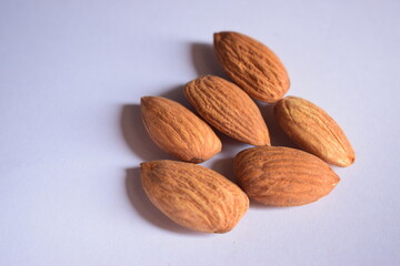 Top View of Closeup Organic Almond Nuts in Group On isolated White Background