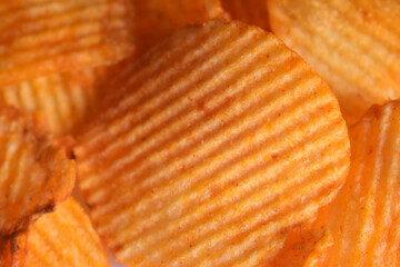 Top View of Closeup Golden Potato Chips On isolated White Background