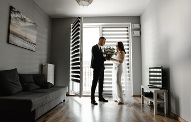 lovely bride waiting for the first meeting with the groom. meeting the newlyweds at the wedding. beautiful and happy couple kissing and hugging