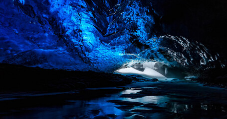Glacial Ice Cave, Svinafellsjokull glacier, Skaftafell National Park, Iceland. Abstract ice background. Blue background with cracks on the ice surface.