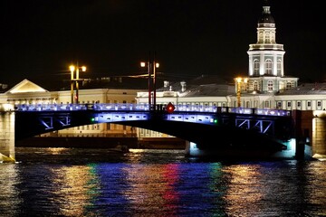 Fototapeta na wymiar Saint Petersburg. Russia. Panoramic view. The Palace bridge is divorced. Raising of the bridges. Bridges Of Petersburg. View from the Neva to the Hermitage. Winter palace in the evening. Panorama of