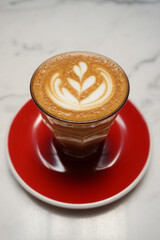 Latte art with red dish