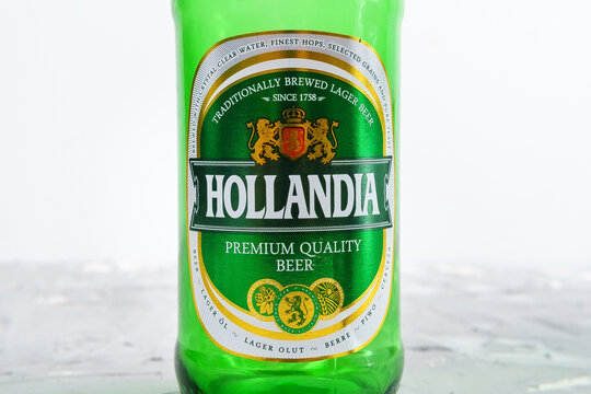 Tyumen, Russia-January 20, 2021: beer hollandia logo glass bottle. selective focus