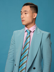 Male Asian appearance jacket tie official side view cropped view