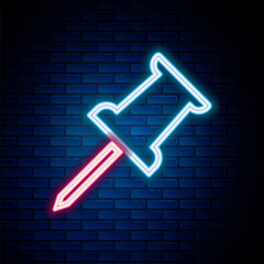 Glowing neon line Push pin icon isolated on brick wall background. Thumbtacks sign. Colorful outline concept. Vector.