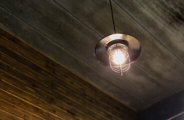 Orange light bulbs hang in the bright room for interior decoration.