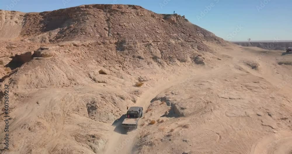 Wall mural jeeping on a desert mountain