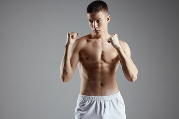 guy are boxing on gray background and naked torso muscle bodybuilder 