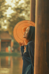 Beautiful Vietnam girl from Hue city, Vietnam who wearing Ao dai. Ao dai is famous traditional custume for woman in Vietnam. Vintage style,travel and relaxing concept.