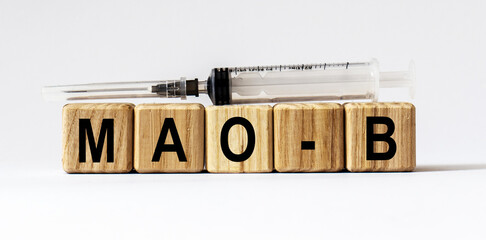 Text MAO-B made from wooden cubes. White background